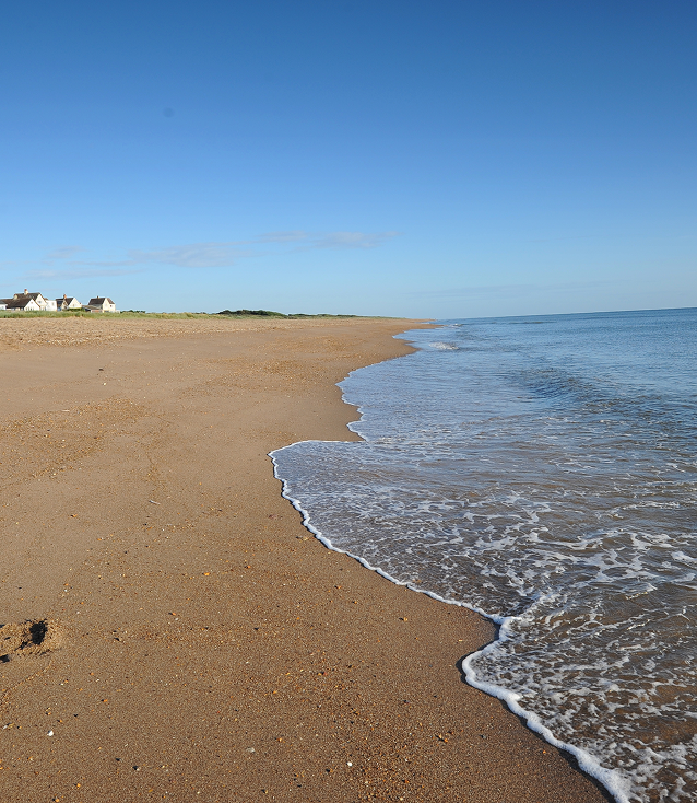 Quiet sandy beach with sea and sky on the Lincolnshire coast