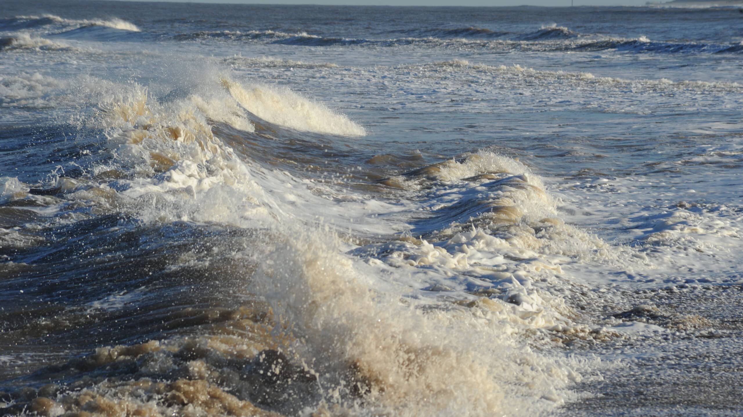 Rough sea with strong waves and sea spray
